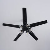 Black ceiling fan seen from below against a plain ceiling