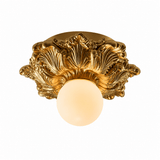 Gilded gold carved floral ceiling light seen at an angle