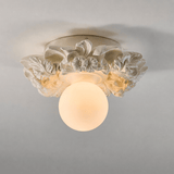 Ivory carved floral ceiling light against a gray ceiling