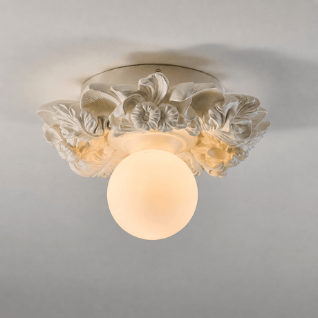 Ivory carved floral ceiling light against a gray ceiling