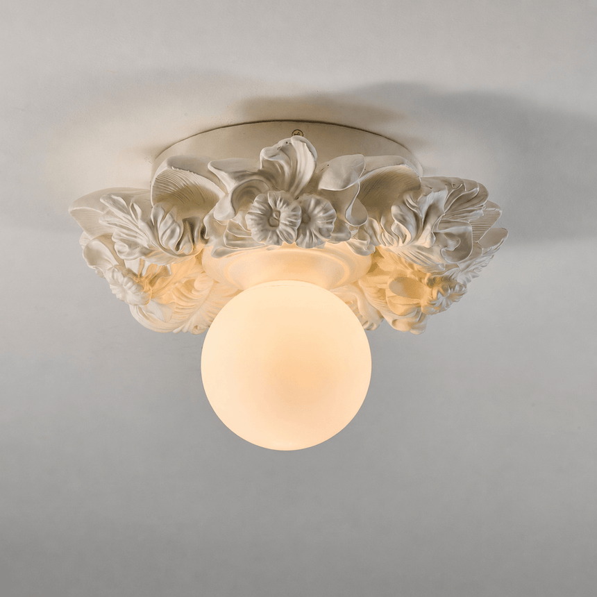 Ivory carved floral ceiling light against a gray ceiling