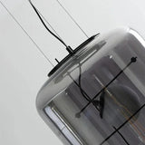 Close view of the thin metal frame crossing the glass drum