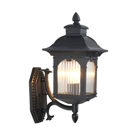 The lantern lit on a white background, showing the scroll arm and the ornate back plate