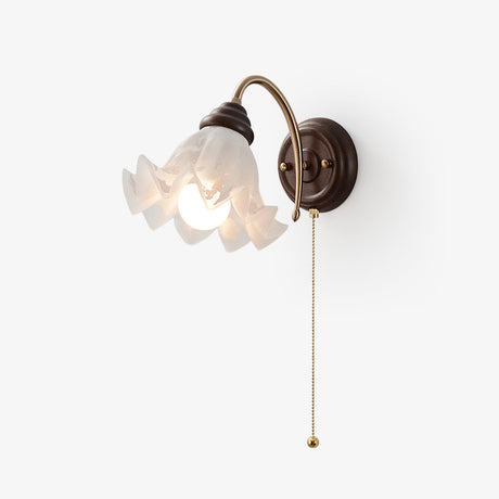 Vintage wall lamp, a ruffled white glass shade on a brass arm off a wood plate