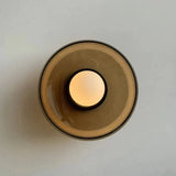 Glass wall lamp with warm LED ambient glow for living room