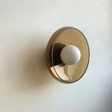 Wall lamp with shade directing light up and down
