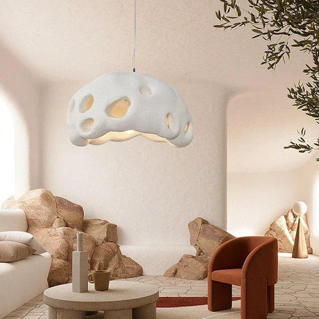 White perforated dome in a pale living room with stone furniture