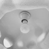 Underside of the shade showing the bulb through the openings