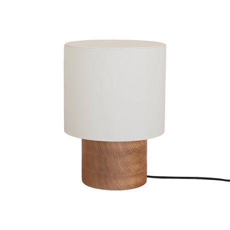Full view of the wabi sabi table lamp against a plain pale ground