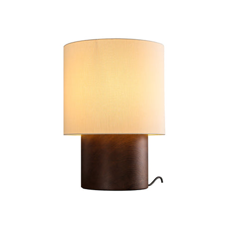 Wabi sabi table lamp in walnut seen from the front, plain ground