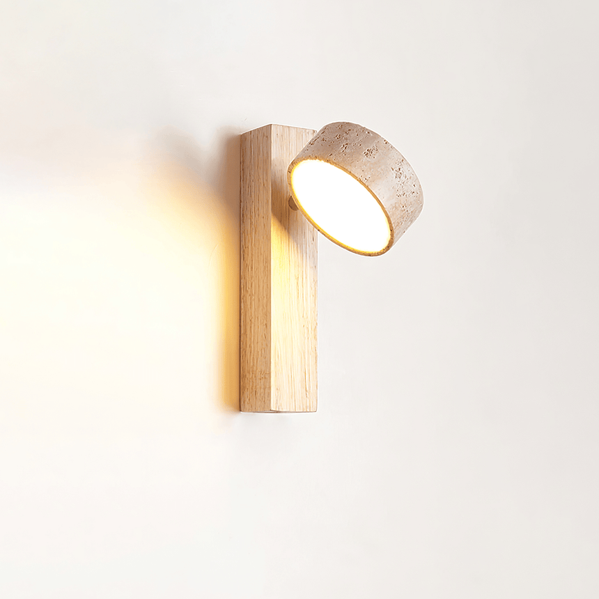 The head turned away from the wall so the beam leaves at an angle