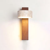 Light wood bar with the travertine drum head lit, the beam falling below
