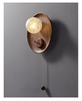 The fitting at an angle, the globe standing forward of the walnut face