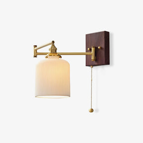 Wall lamp with a pull chain switch, white ceramic shade on a brass swing arm