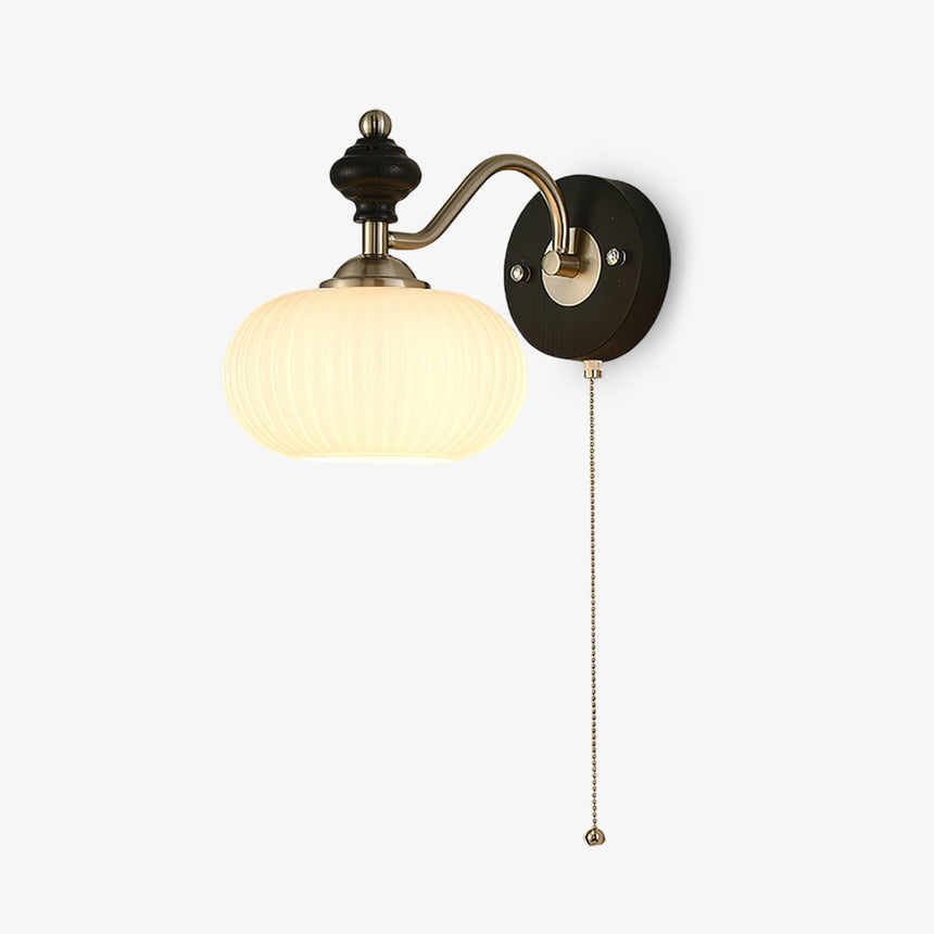 Wall lamp with switch, a nickel arm and glass shade with a pull cord