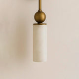 Close view of the brass ball and the top of the stone tube