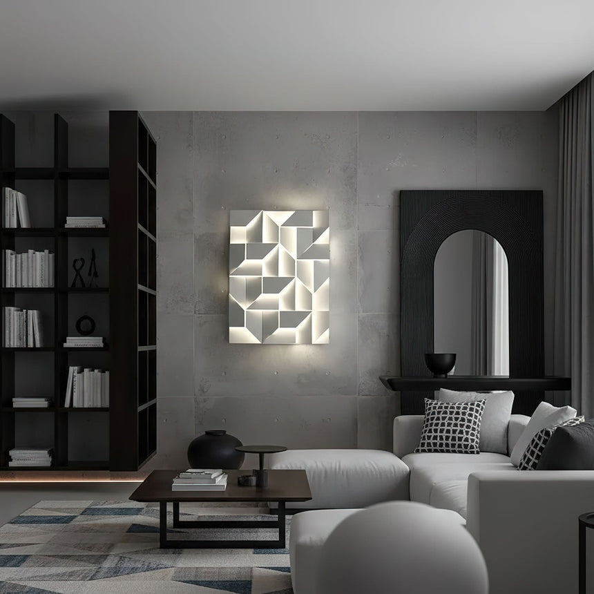 Lit in a living room above a pale sofa beside tall shelves and a dark arch