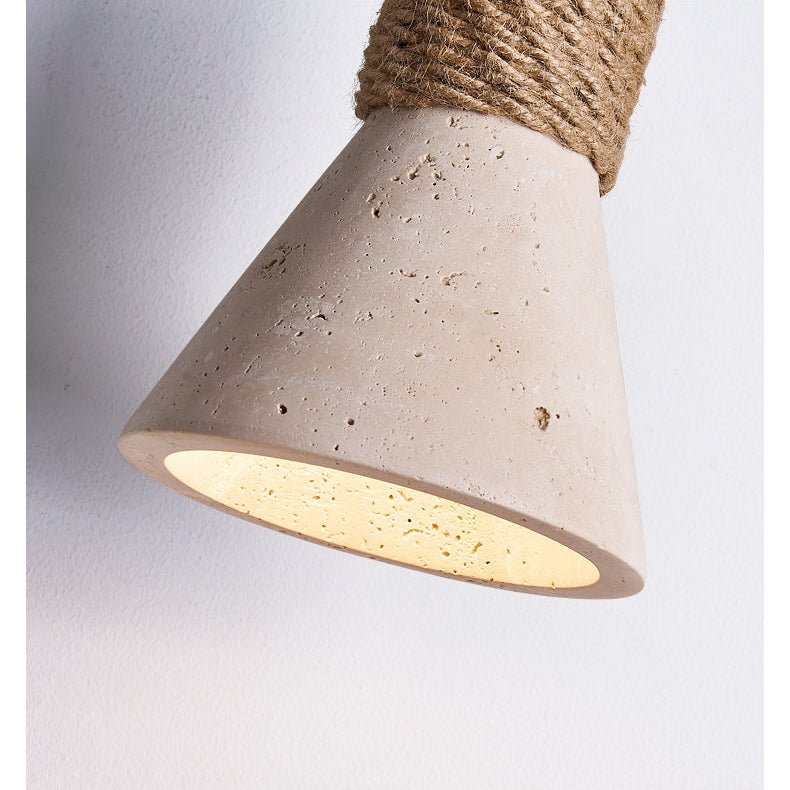 The travertine cone seen from below, the light pooling out of the opening