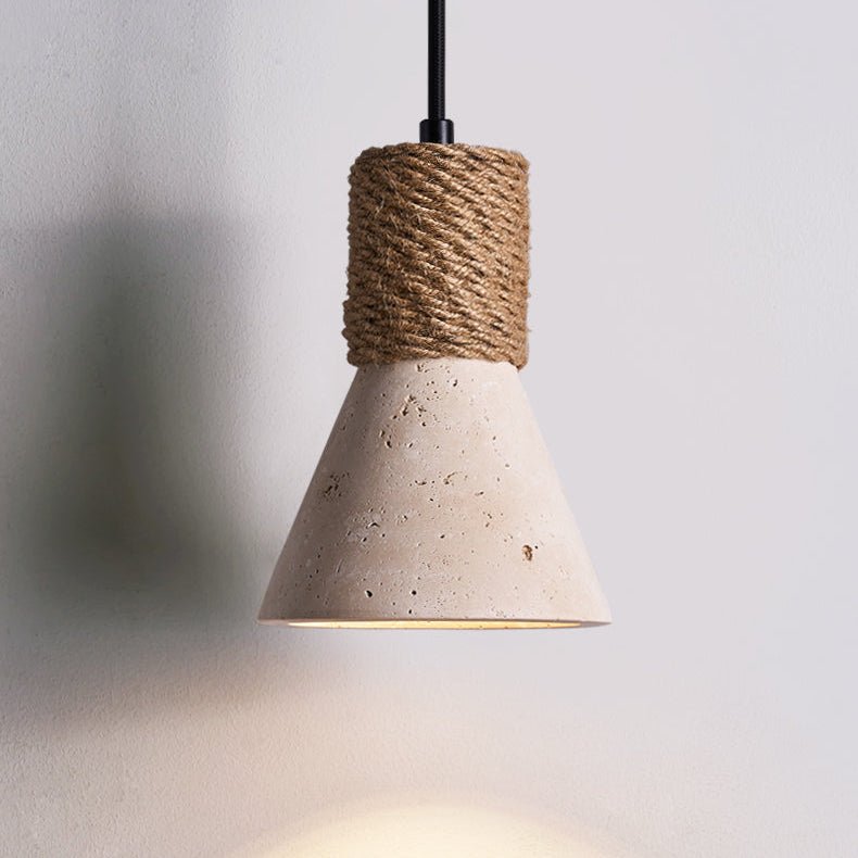 The travertine cone lit, the glow falling on the wall below