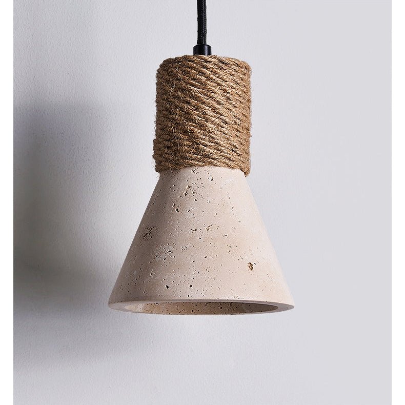 The travertine cone and its jute rope collar, photographed close