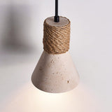 The cone seen close, the pores of the travertine and the rope wrap
