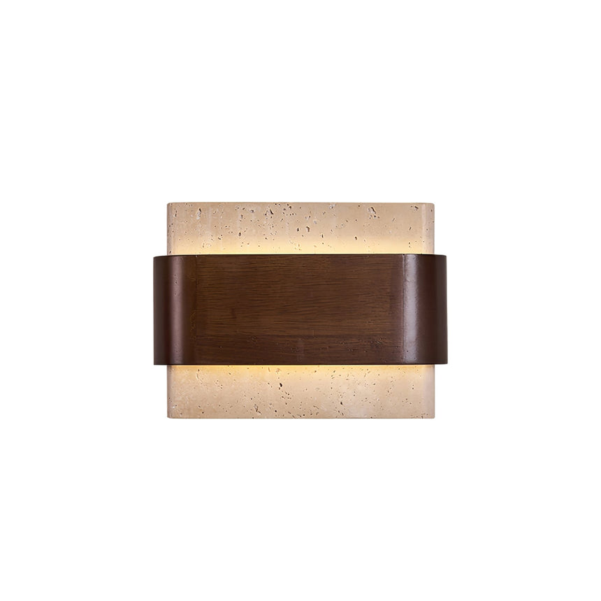 The travertine block seen from the front with the walnut band across it