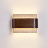The block lit, warm light leaving above and below the walnut band