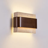 Light spilling upward and downward from the stone above the wood band