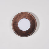 Walnut drum unlit, the white disc flat inside the straight wood rim