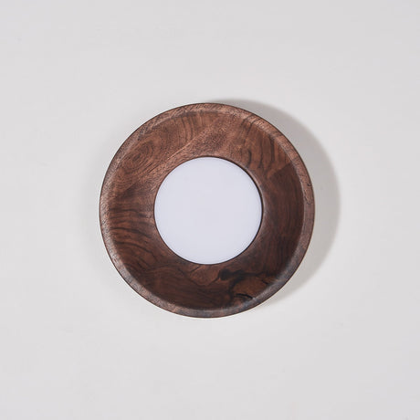 Walnut drum unlit, the white disc flat inside the straight wood rim