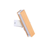 The bar set on a diagonal, the white bracket small behind the wood
