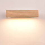 The wood bar lit warm and level, the light spreading evenly below it