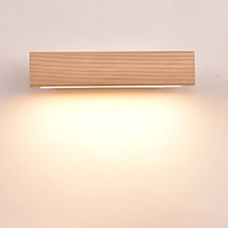 The wood bar lit warm and level, the light spreading evenly below it