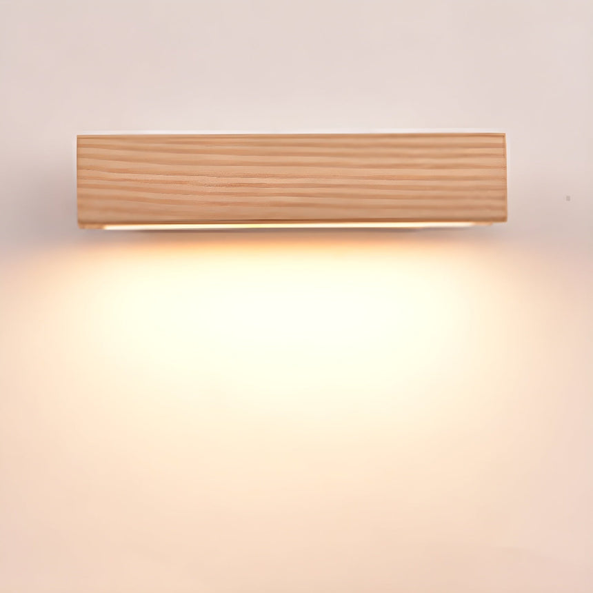 The wood bar lit warm and level, the light spreading evenly below it