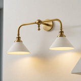 Close view of the double version lit, two white cones on a brass bridge arm