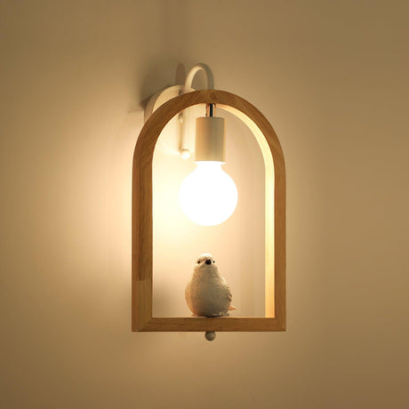 The bird lit against a warm ochre wall, the globe bright above it