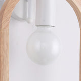Close view of the clear globe lamp hanging from the white socket