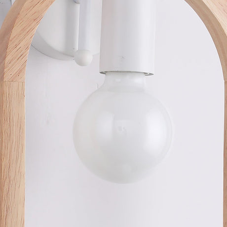 Close view of the clear globe lamp hanging from the white socket