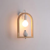 The bird model lit on a pale wall, the globe glowing inside the arch