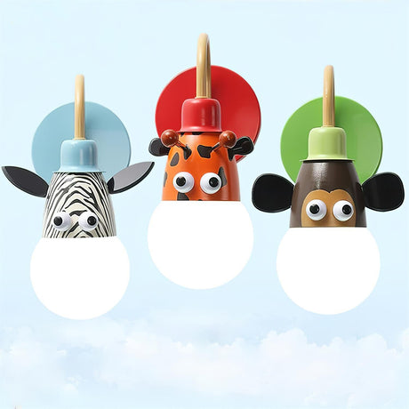 The three animal lamps together, a zebra, a tiger and a monkey, all lit