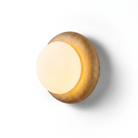 The lit fitting seen at an angle, the globe clear of the softened wood edge