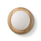 The wood disk seen square on, the frosted globe standing forward of its face