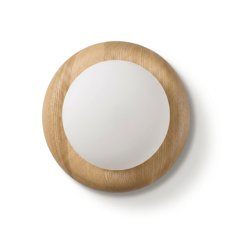 The wood disk seen square on, the frosted globe standing forward of its face