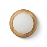 The open grain of the solid wood disk running around the frosted globe