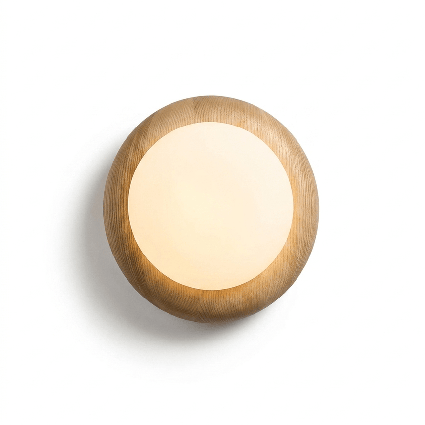 The globe lit inside the cushioned wood disk, the grain warm around it