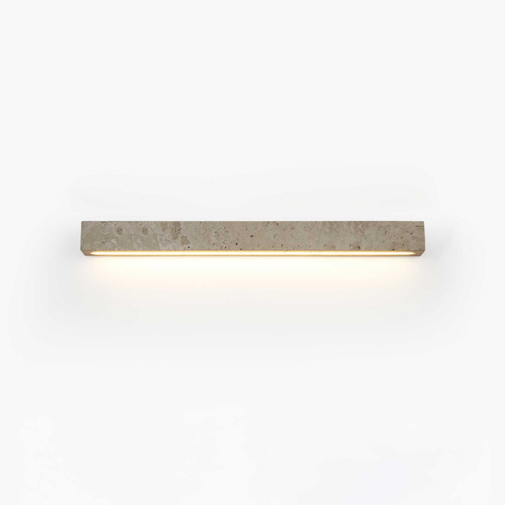 Solid travertine bar on a wall, a warm slot of light running along its lower edge