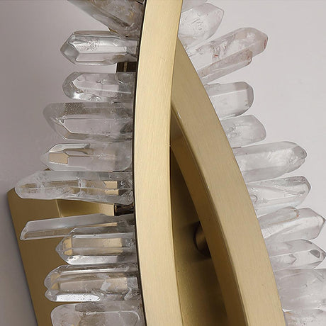 Close view of the clear crystal points along the gold arm