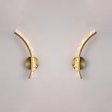 The left and right arms shown apart on a pale wall, each on its own round plate
