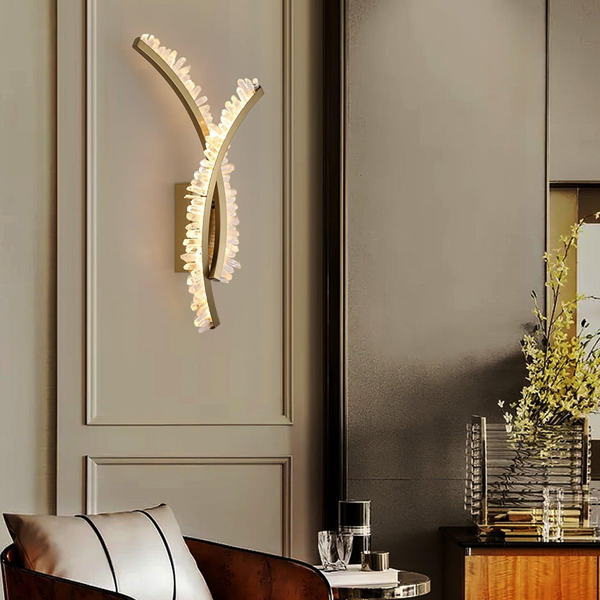The crossed arms on a paneled wall above a leather chair and a vase of flowers