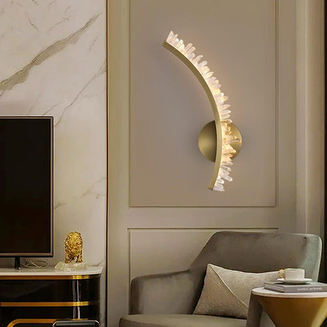 One curved arm lit on a paneled wall between a TV and an armchair